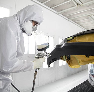 Collision Center Technician Painting a Vehicle | Simi Valley Toyota in Simi Valley CA