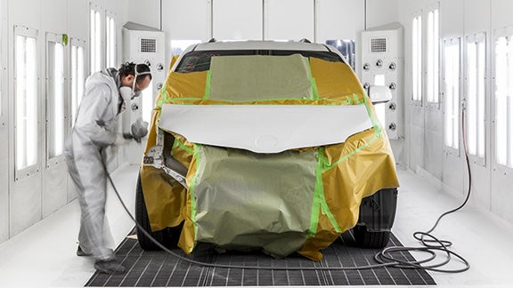 Collision Center Technician Painting a Vehicle | Simi Valley Toyota in Simi Valley CA